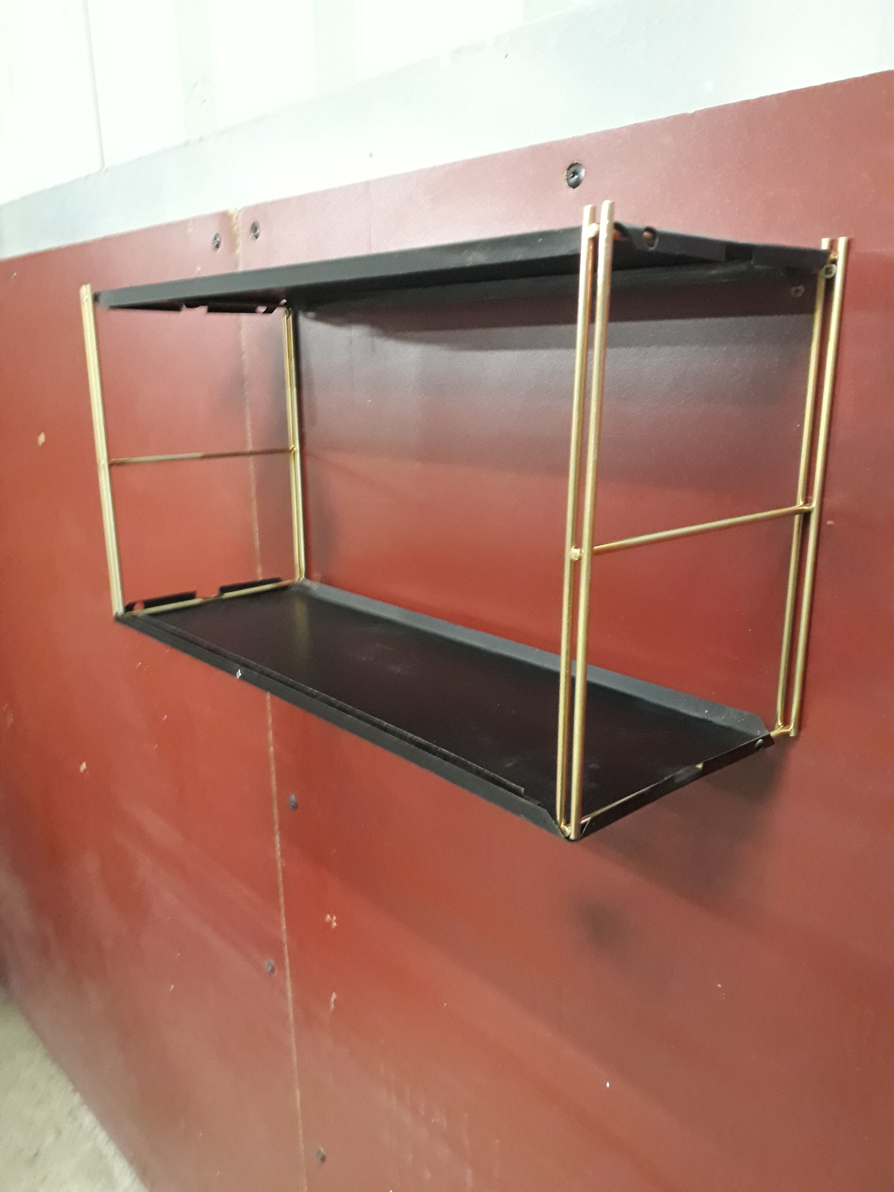 Wall-mounted Tomado showcase 1960