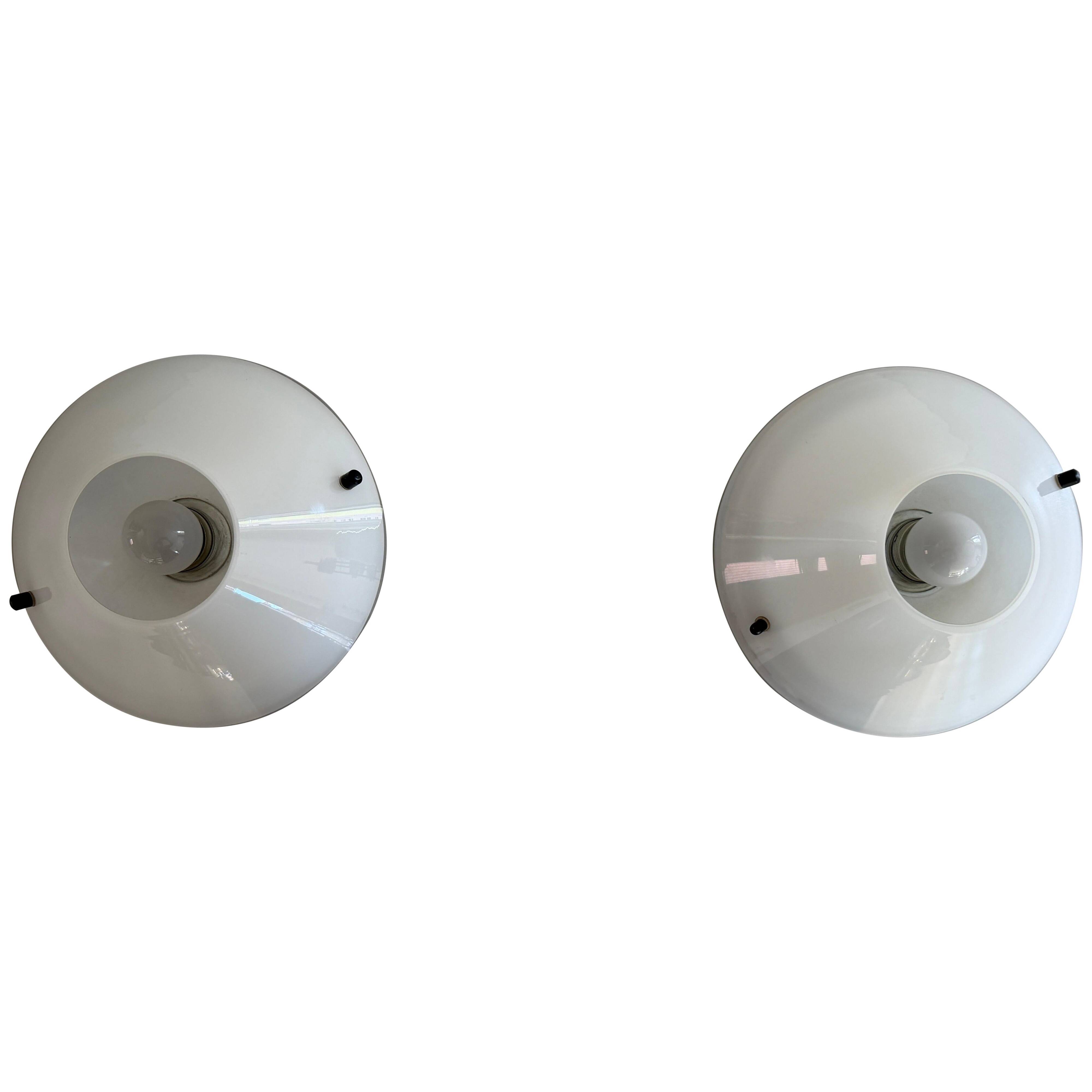 Pair of opal glass wall lights from the mid-century by Lamperti, 1960s, Italy.