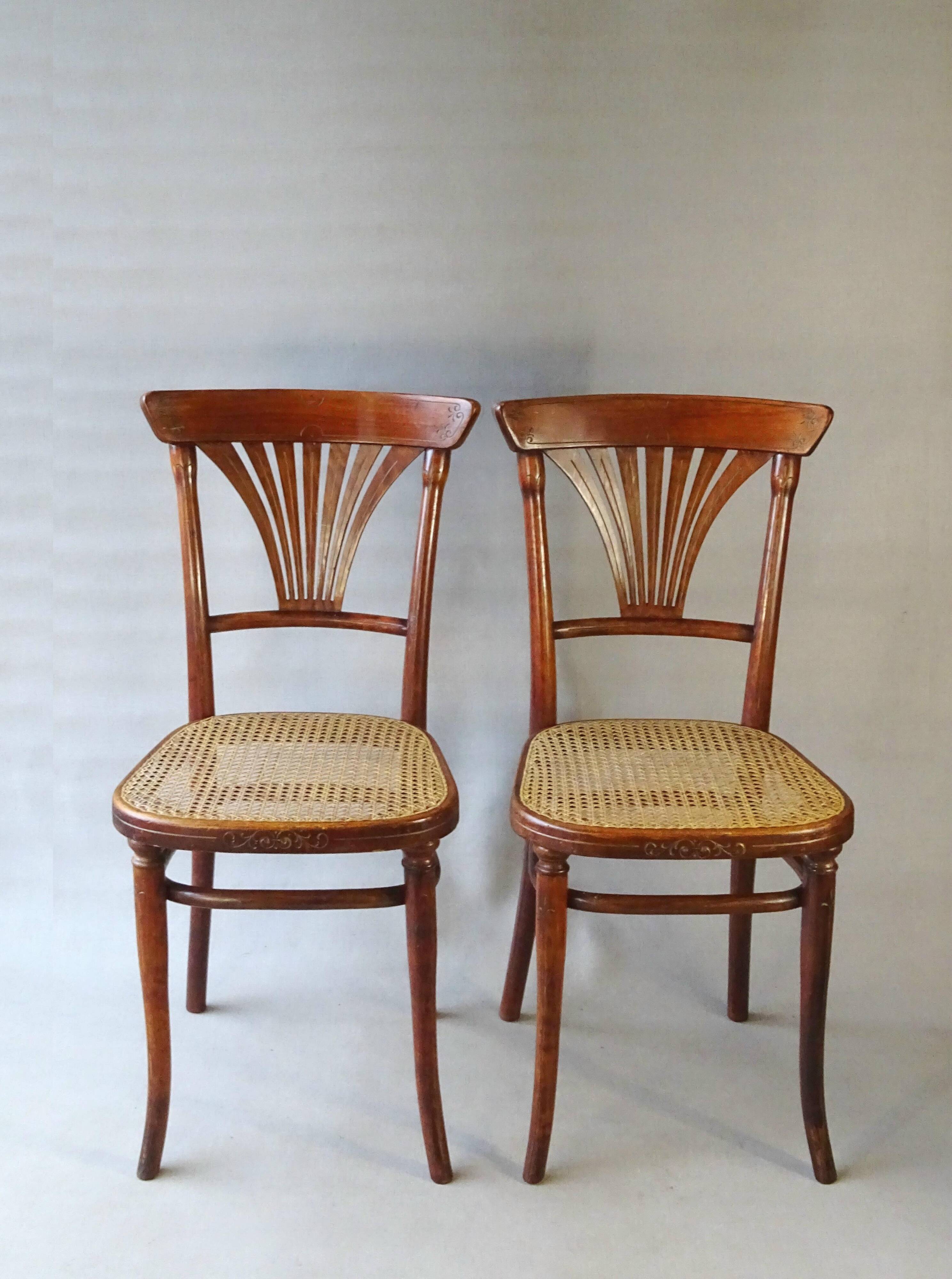 2 Thonet N°221 chairs, caned Art Nouveau bronze decor