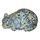 Vintage white and blue porcelain lying cat
