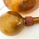 Biot blown glass amber bottle