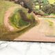 Oil on old cardboard depicting a hilly country landscape