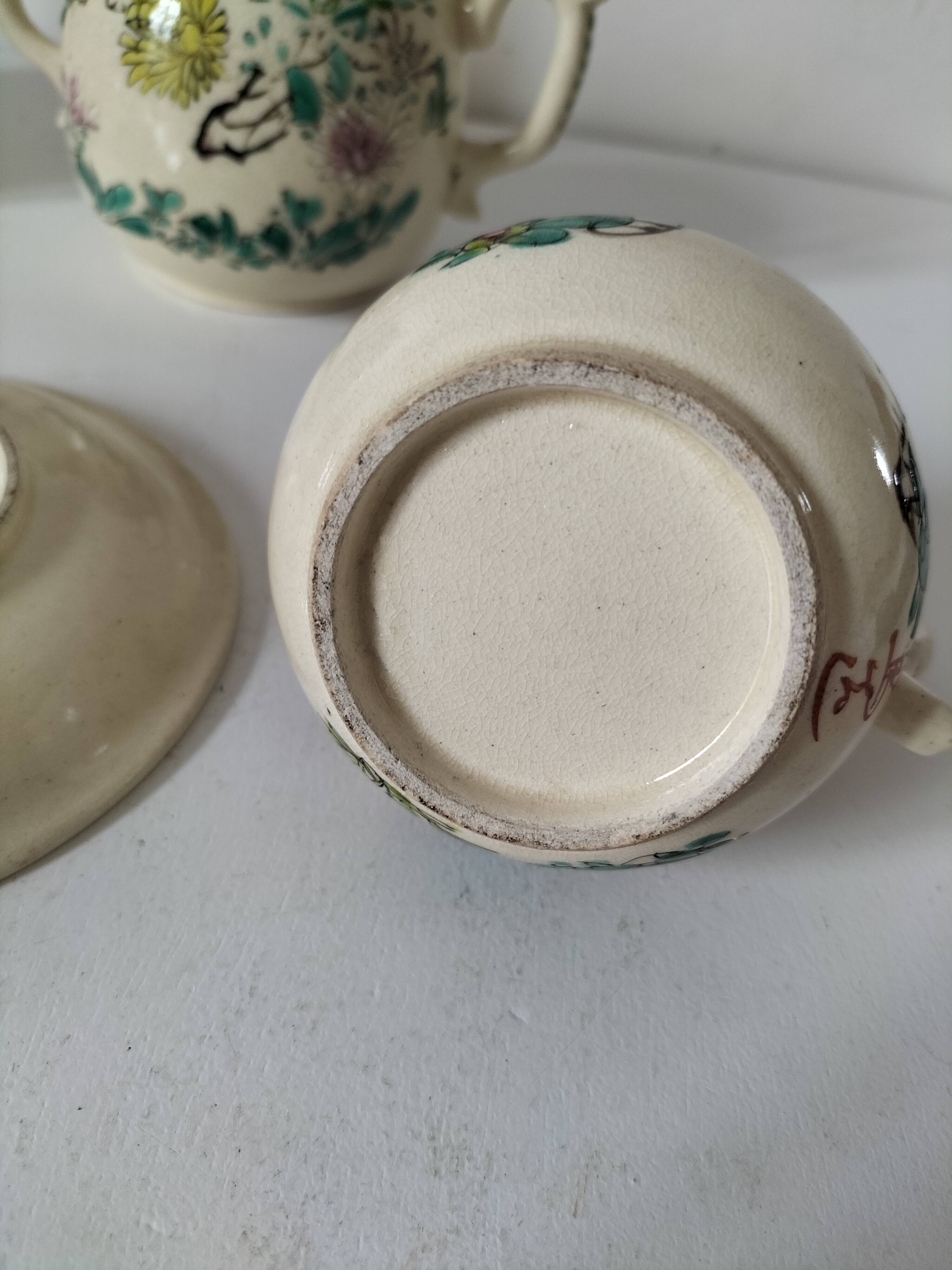 Japanese-style tea set in cracked earthenware with chrysanthemum flowers