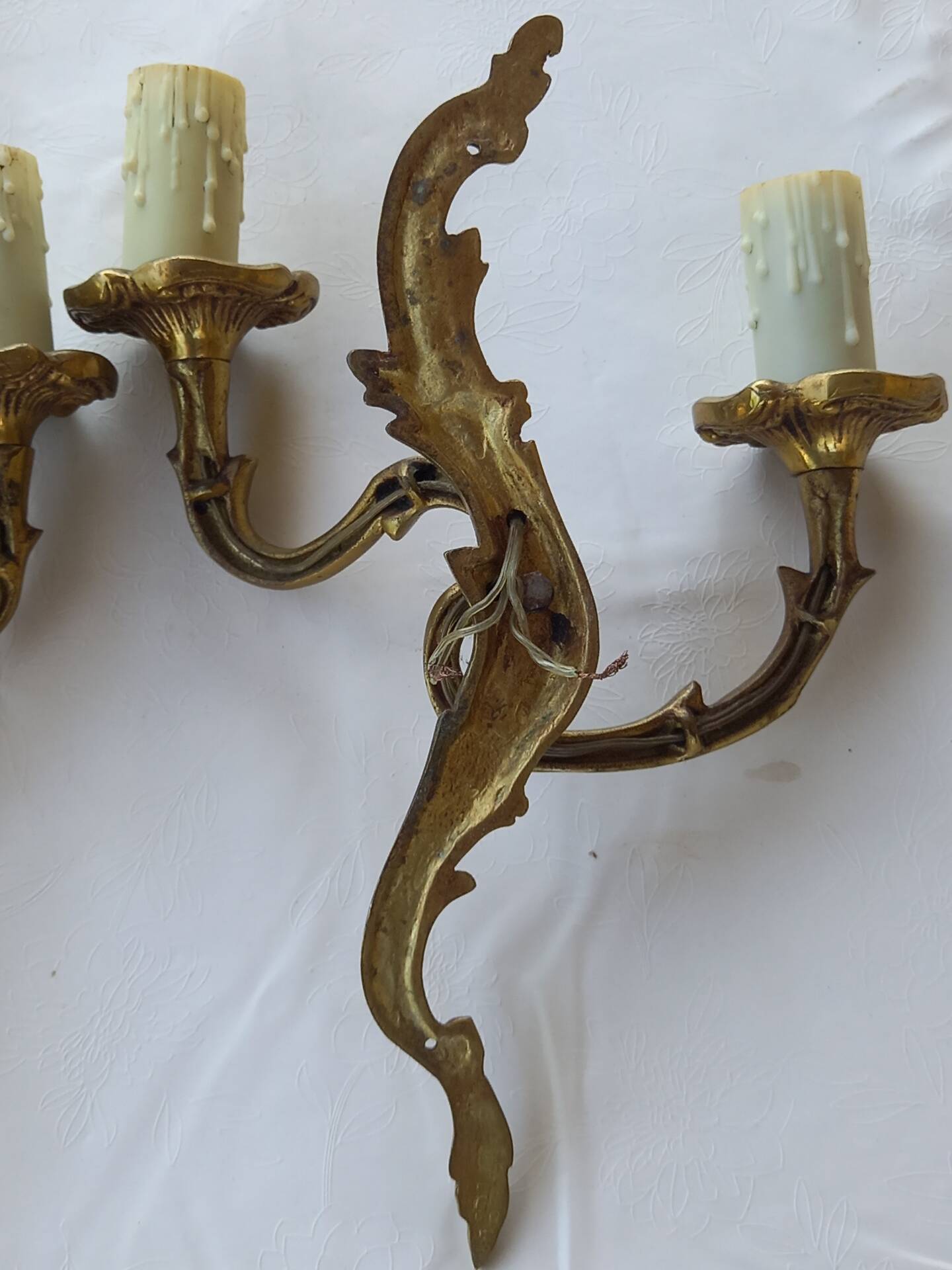 Old pairs of bronze wall sconces