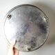 Small Moroccan tripod tea tray in silver-plated metal, vintage chiseled decoration.
