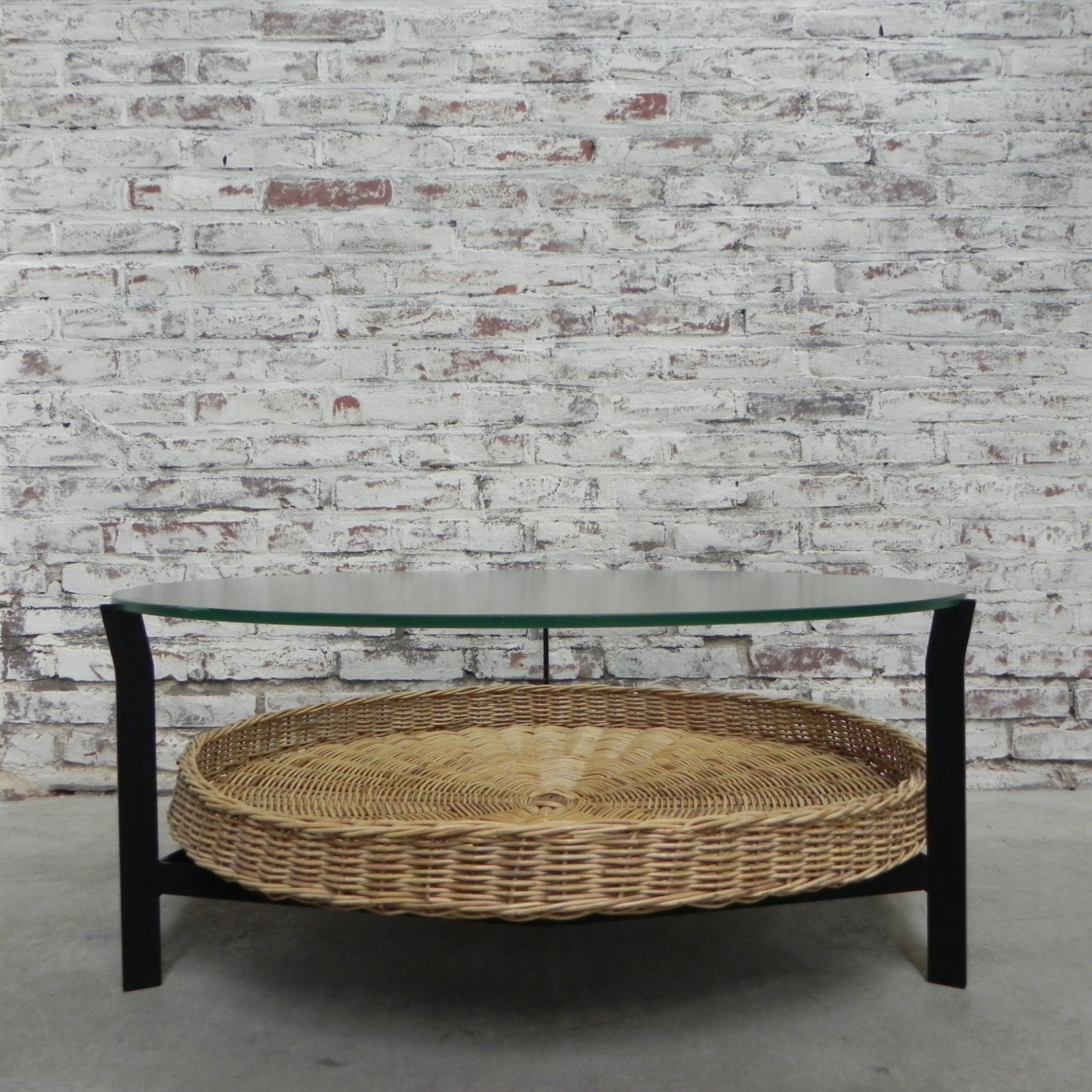 Vintage coffee table with glass top and rattan basket