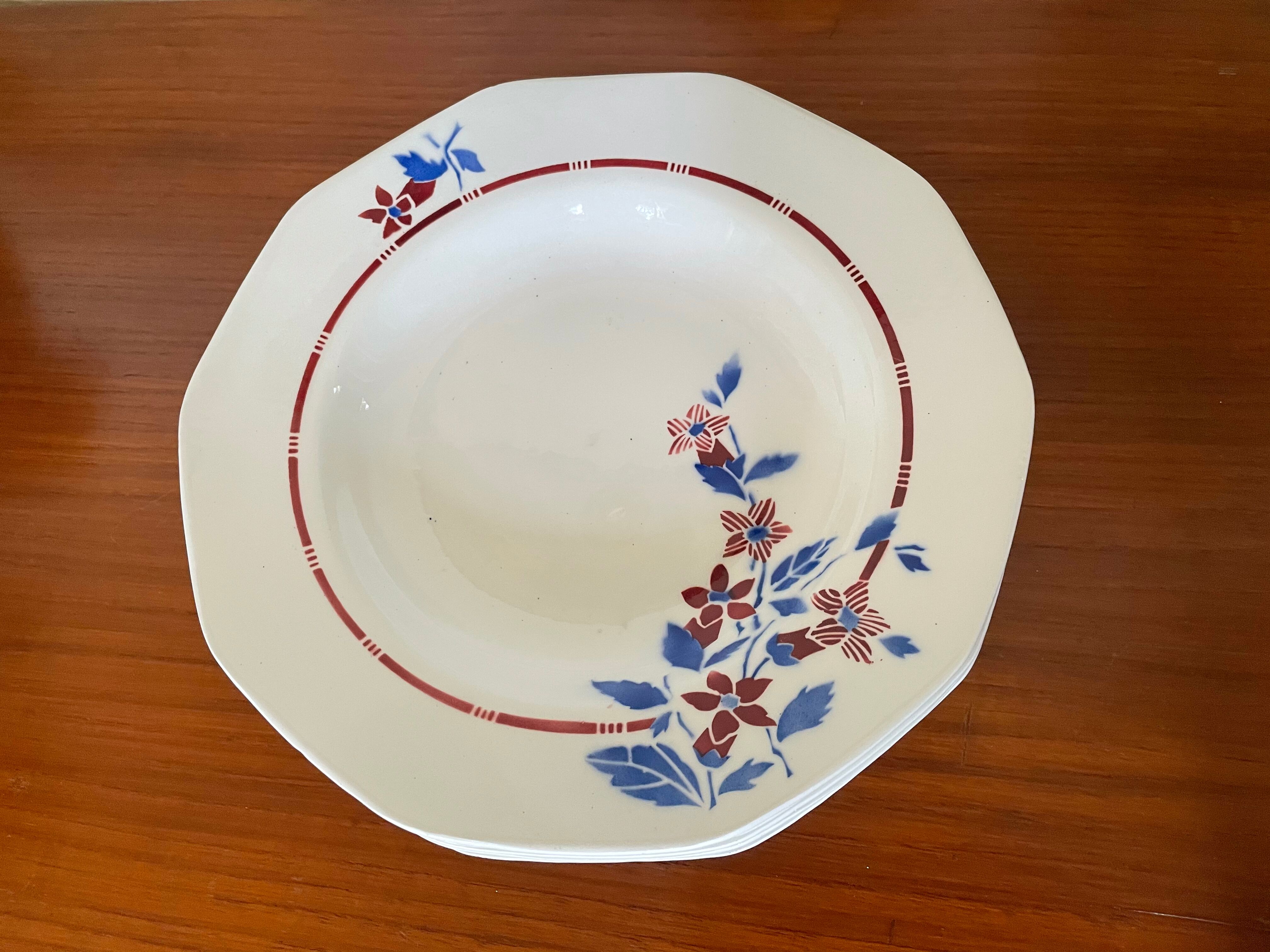 Saint Amand hollow plates decorated with red and blue flowers