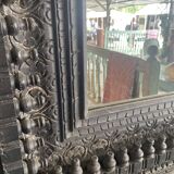 Black carved wooden mirror