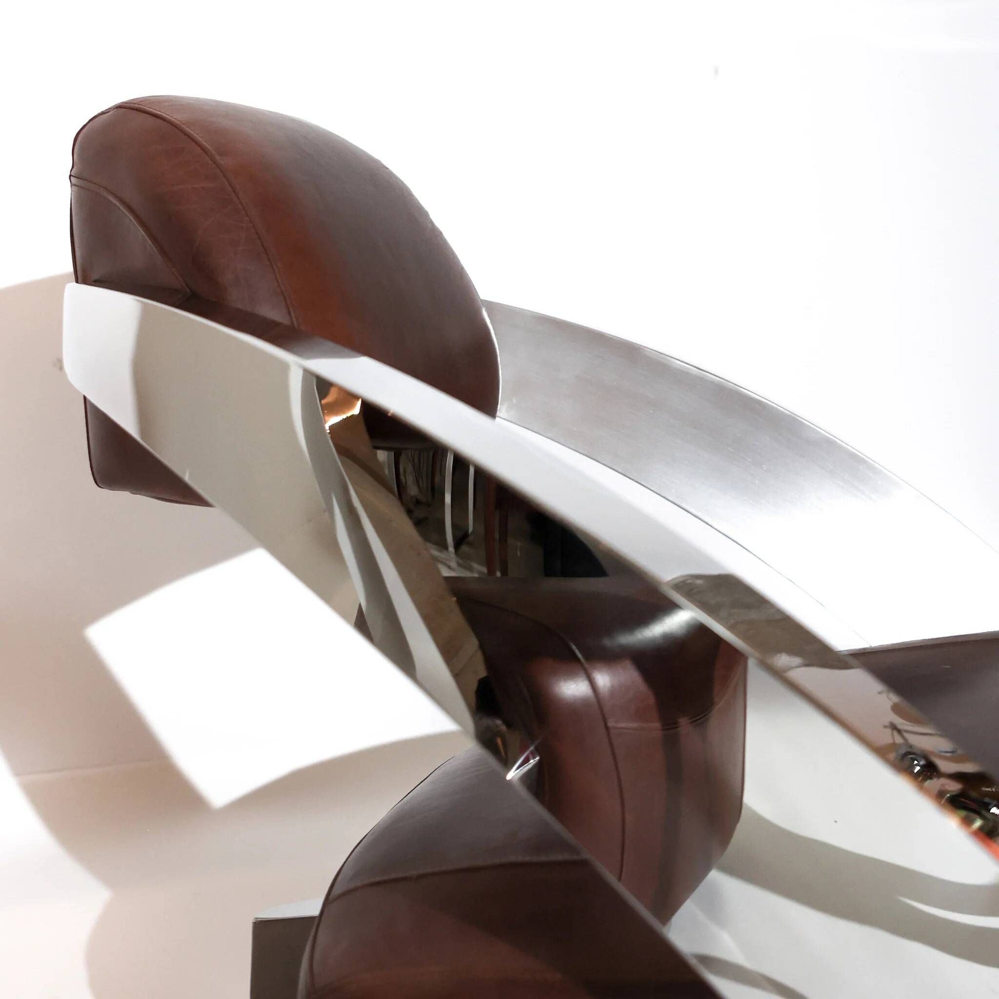 Pair of vintage lounge chairs Demon/Aviator in cognac leather and polished steel, Art Deco style.
