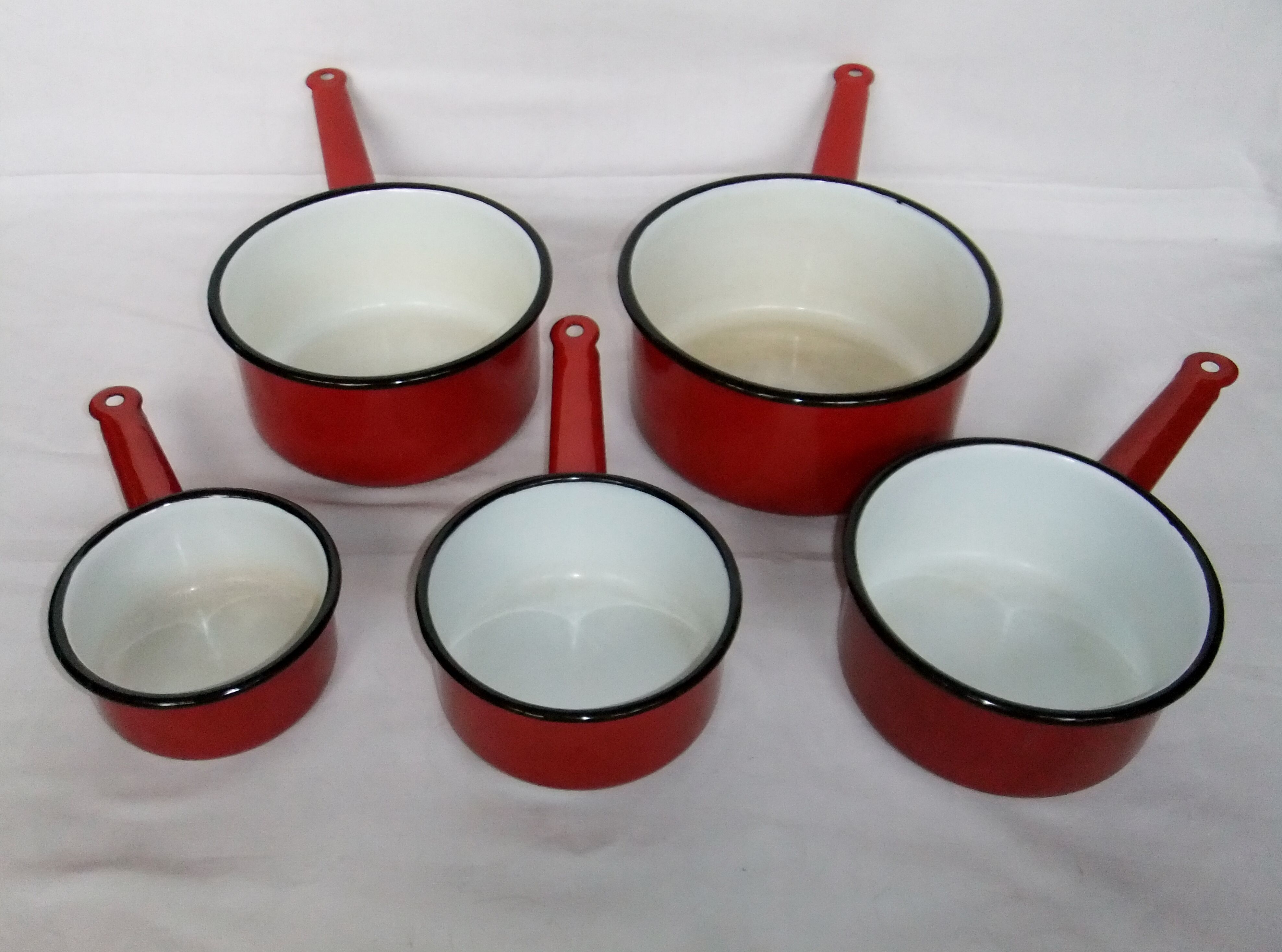 Red enamelled sheet metal pans