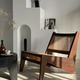 Reclined armchair in canned teak in natural wood