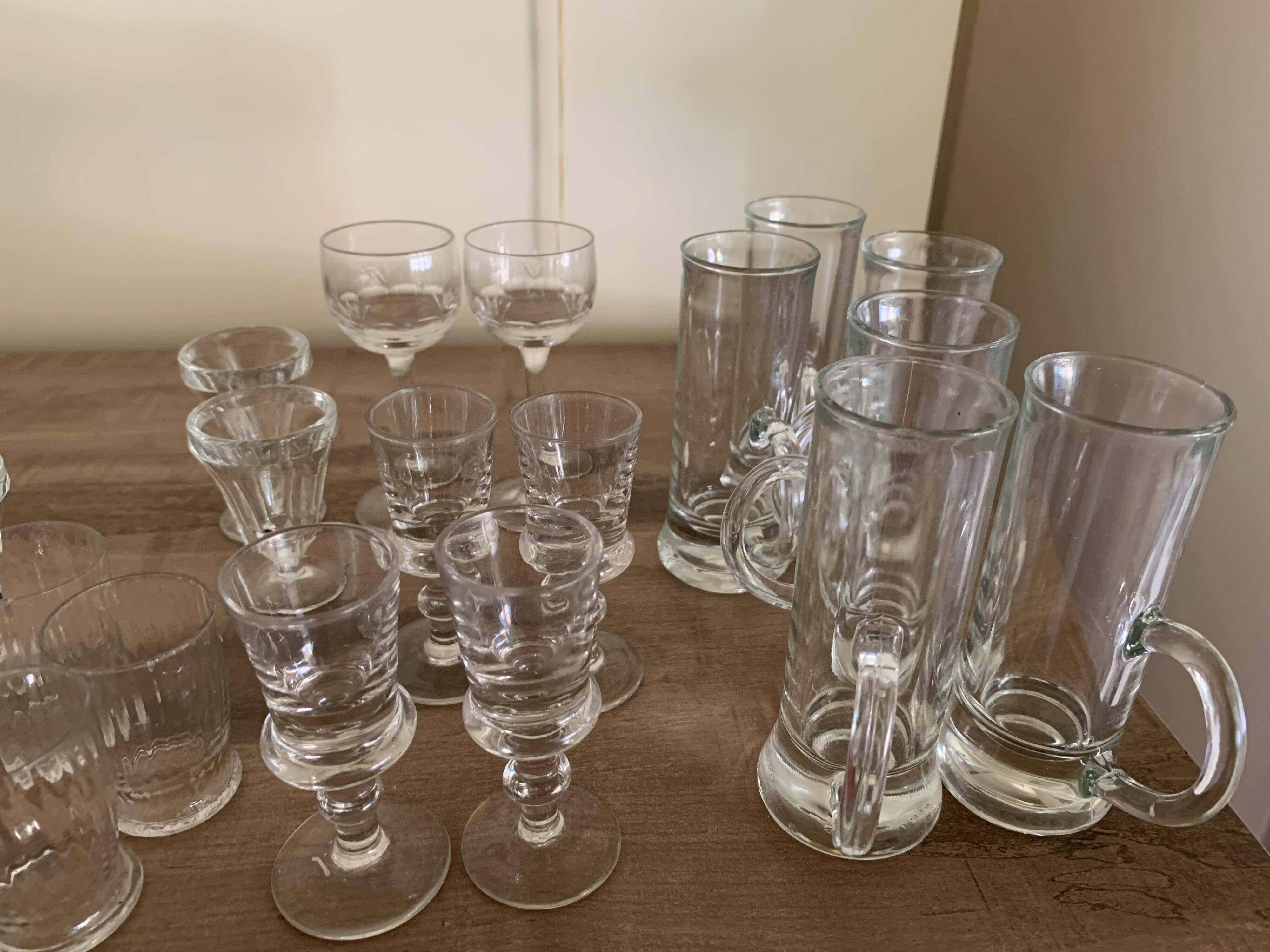 Set of 21 small liqueur glasses and 16 small cups and ramekins.