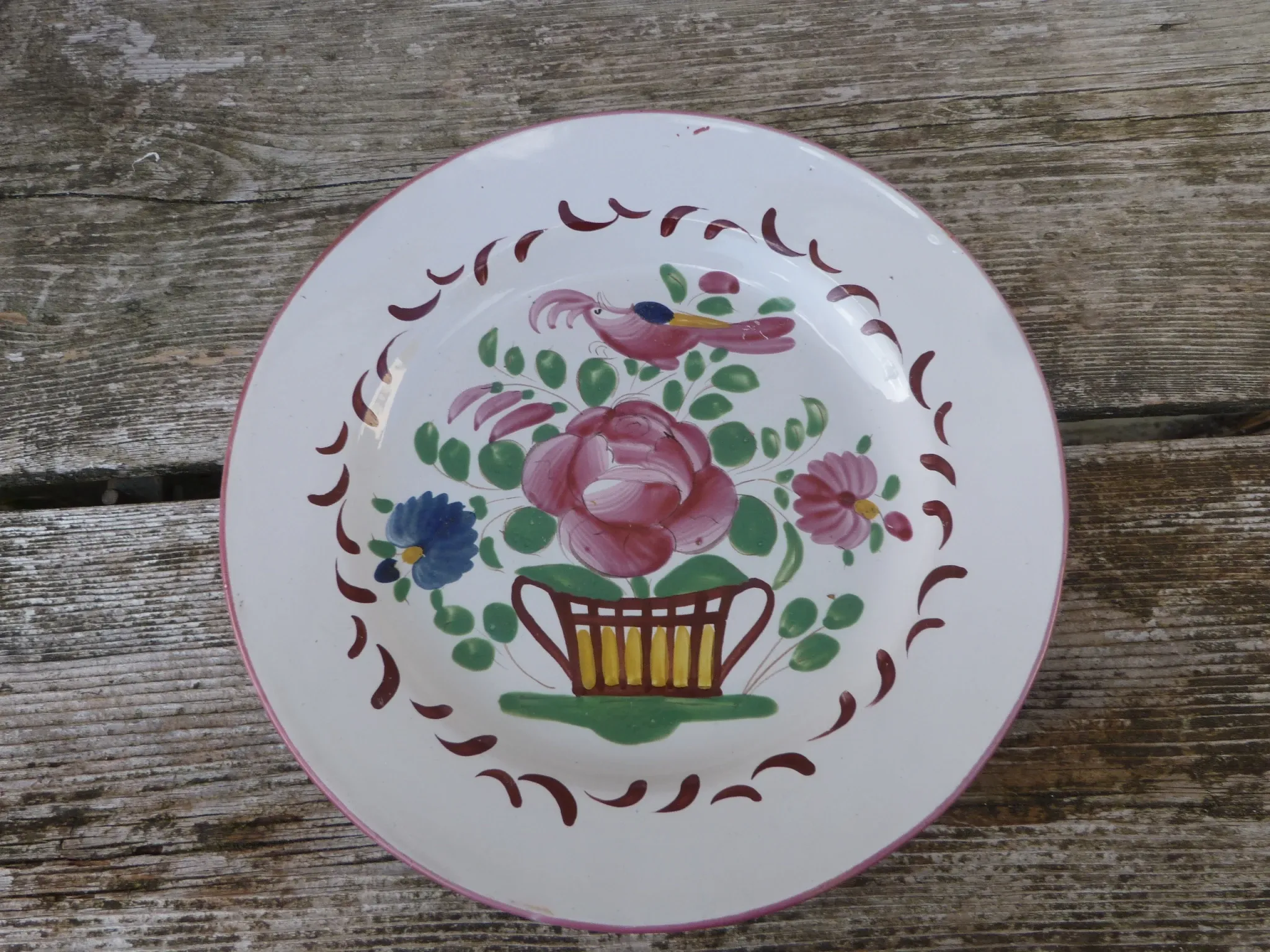 Old St Clément earthenware plate, flat plate with flower patterns.