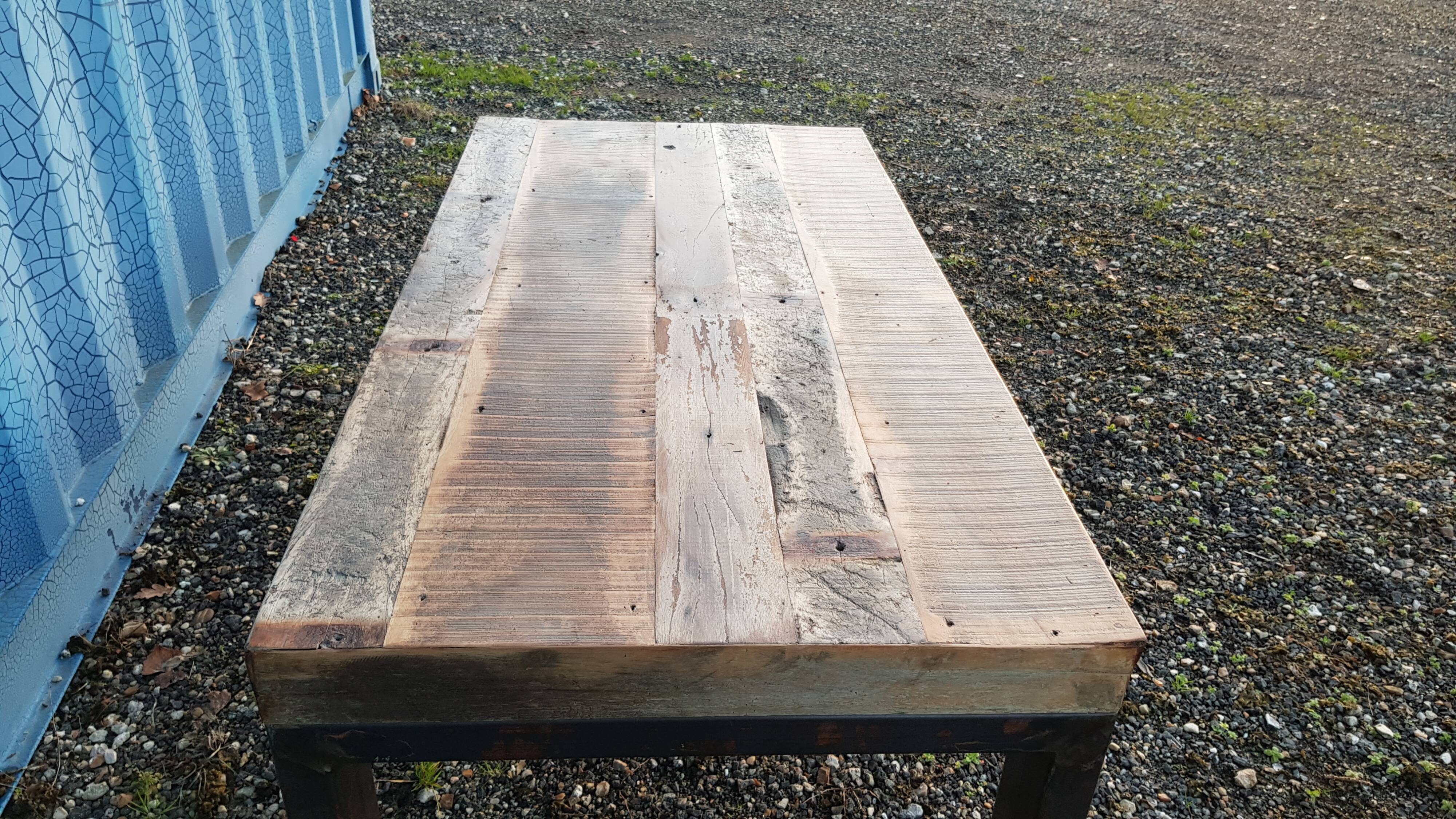 Industrial coffee table with wooden top and metal legs