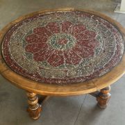 Vintage wooden turned coffee table with leather and astrological decoration.