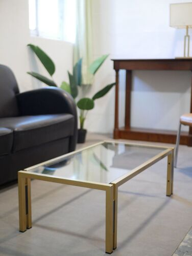 Coffee table design 70s, glass and gold metal
