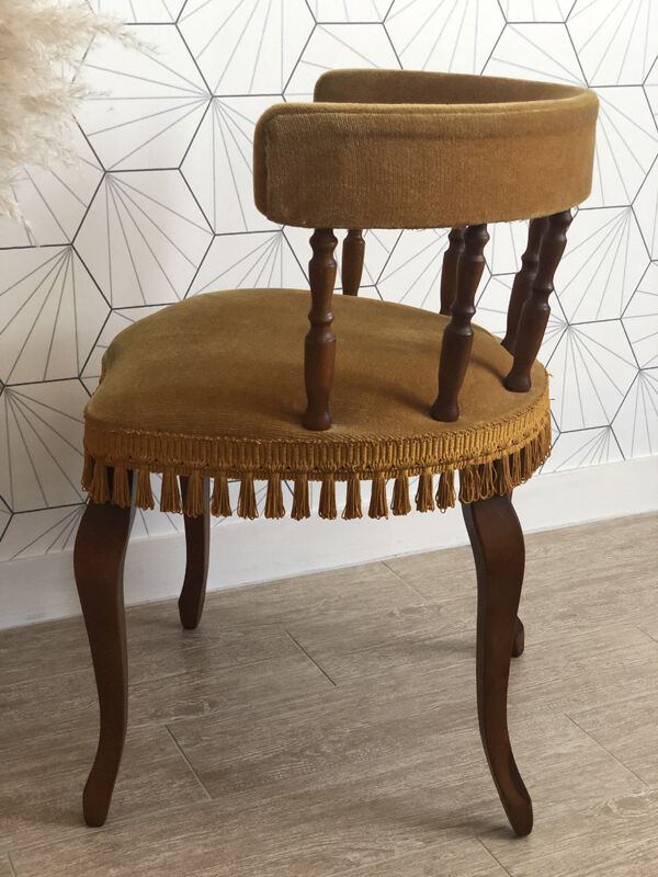 Vintage fringed gondola armchair