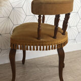 Vintage fringed gondola armchair