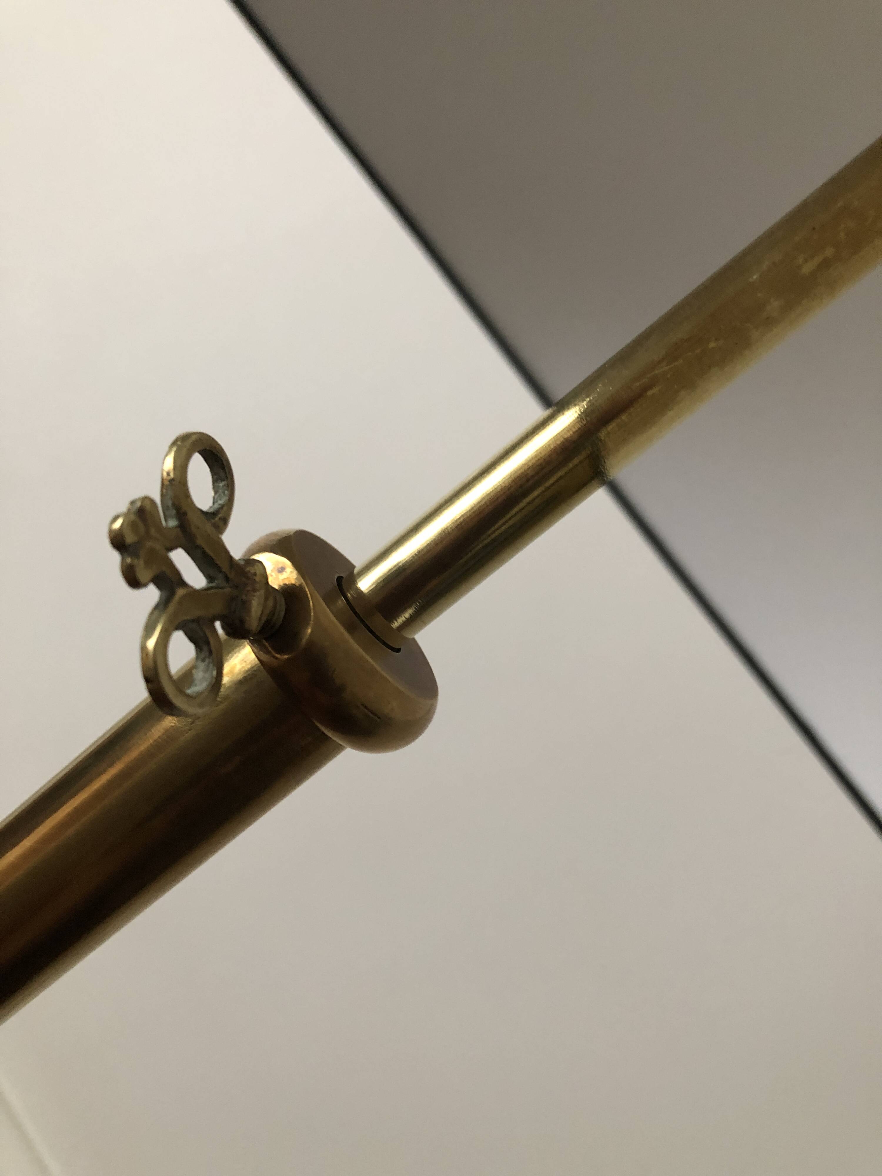 Tripod floor lamp with adjustable height and shelf from the 1960s.