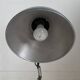 Vintage 1950s green lacquered sheet metal workshop wall light with accordion arm.