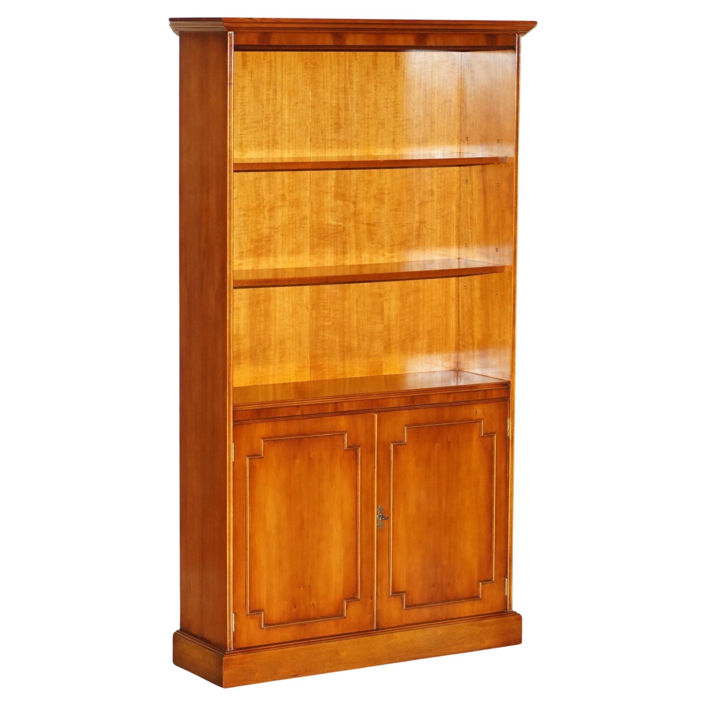 Open library Bradley Furniture made of yew wood with a cupboard base.