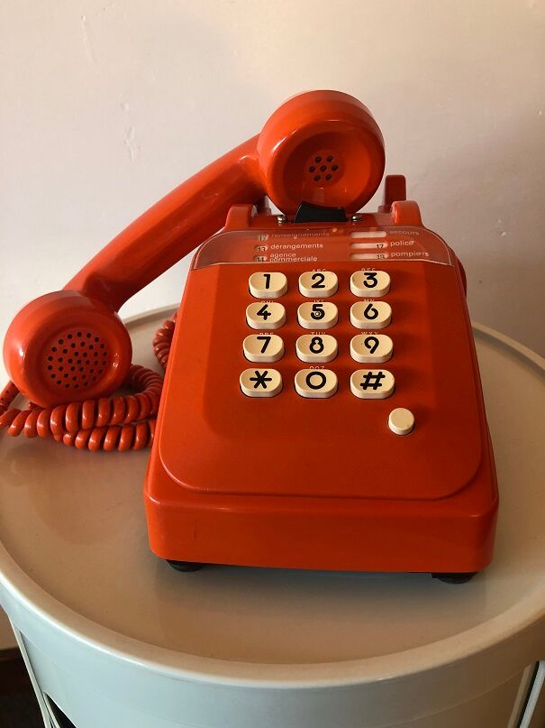 Orange Socotel phone with keys from the 70s 80s