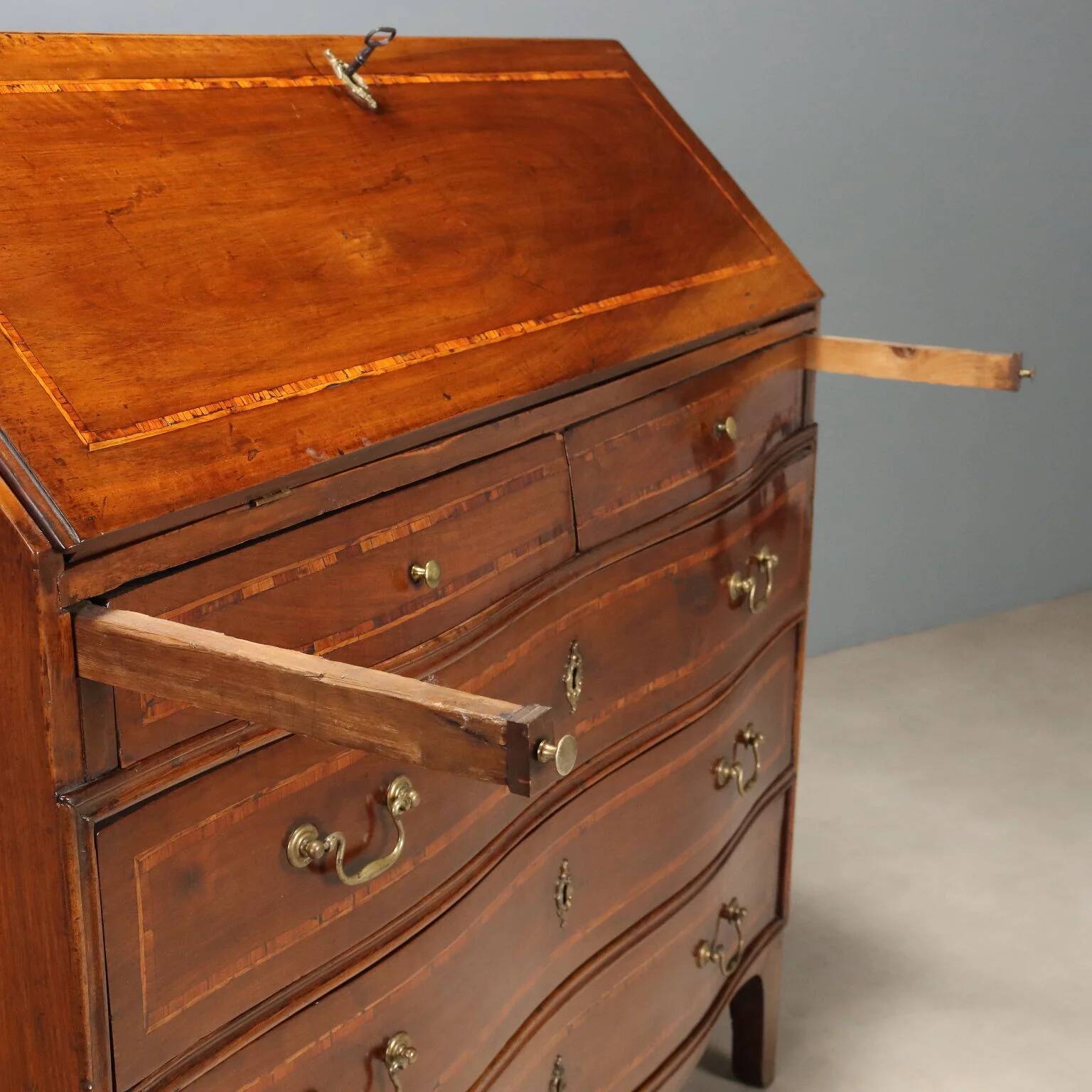 Antique drop-leaf cabinet in walnut with maple inlays, Italy, mid-18th century.