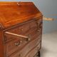 Antique drop-leaf cabinet in walnut with maple inlays, Italy, mid-18th century.