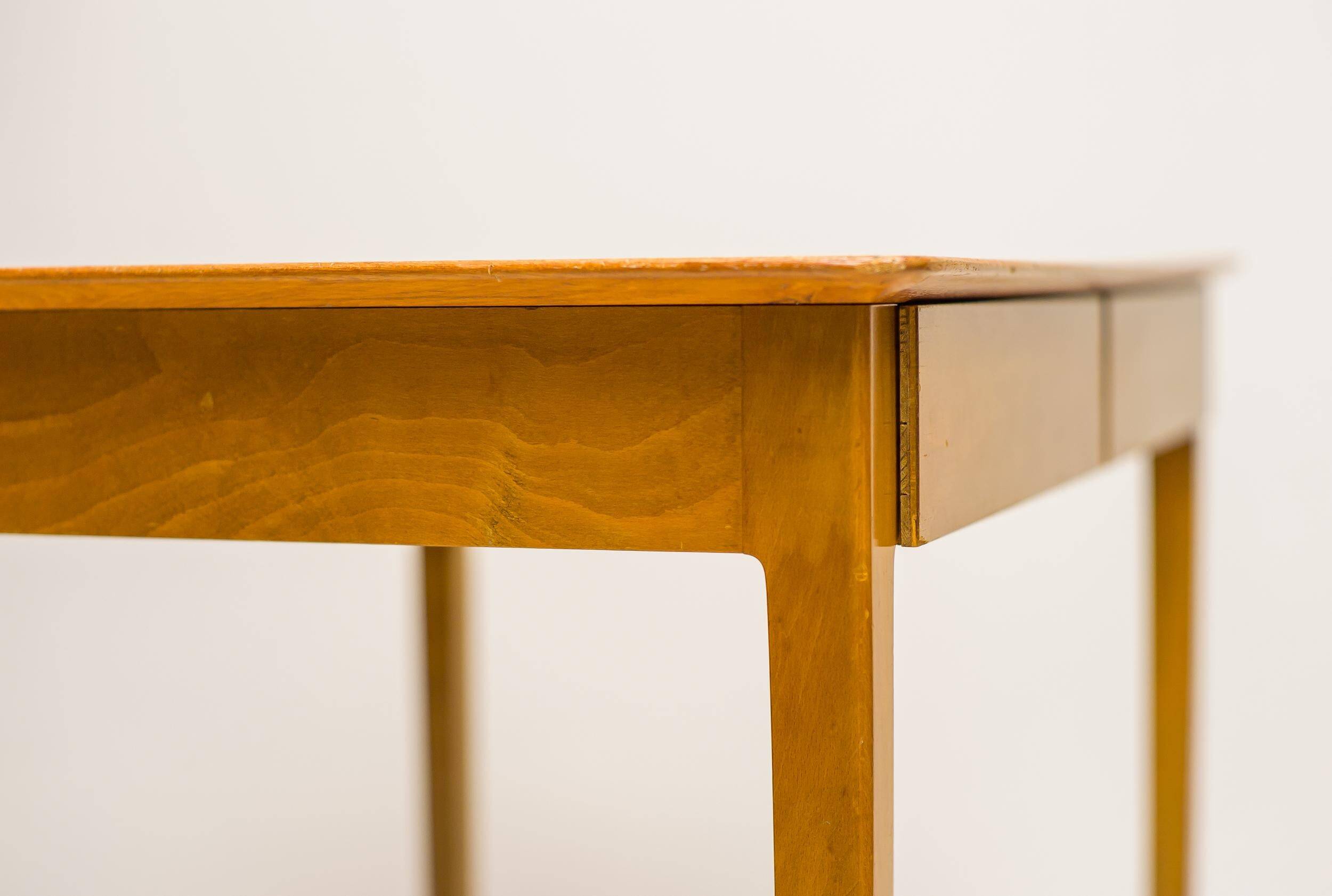 Small maple desk with a laminate top and two drawers, Fritz Hansen, 1950s.