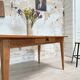 Vintage farmhouse table with spindle legs.