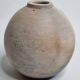Round ceramic vase with raw finish, smoked firing, signed, late 20th century, 11 cm.