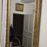 Large antique mirror from the Napoléon III era, finely carved and gilded with gold leaf.