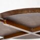 Sculptural coffee table in walnut and glass, Italy, 1950.