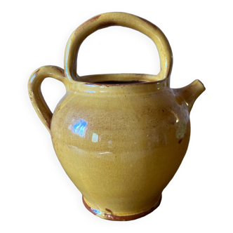 Jug or chevrette in yellow glazed stoneware