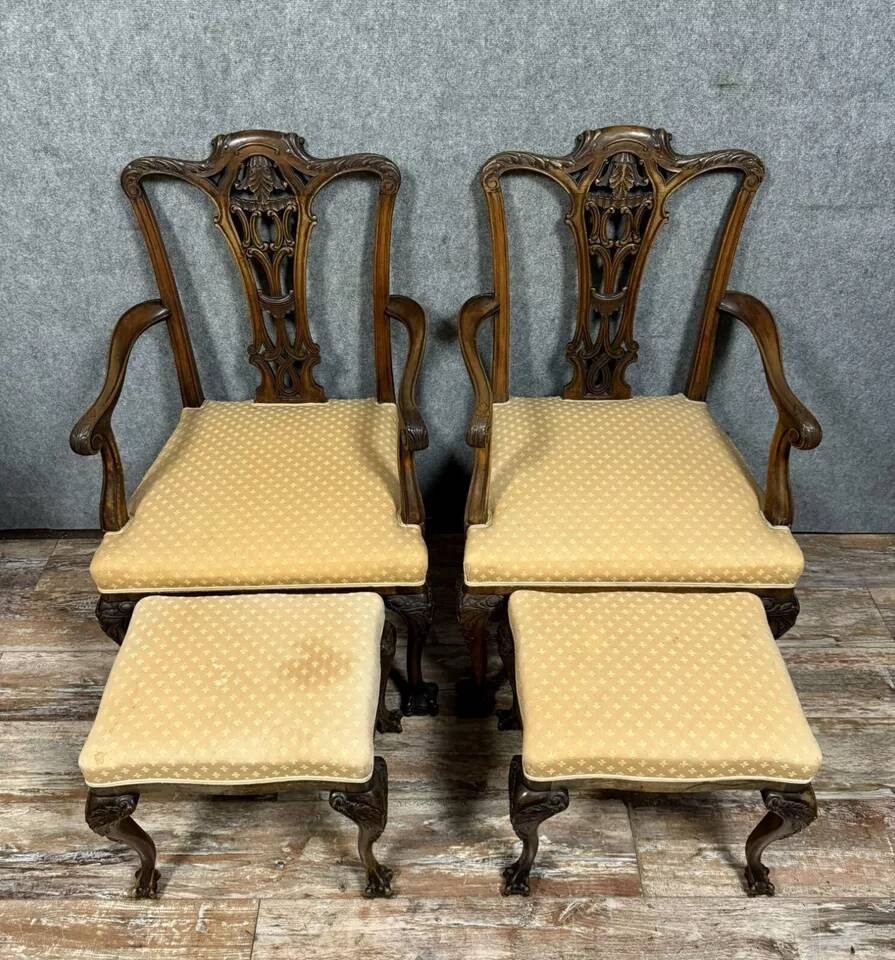Pair of English armchairs with mahogany footrests circa 1850