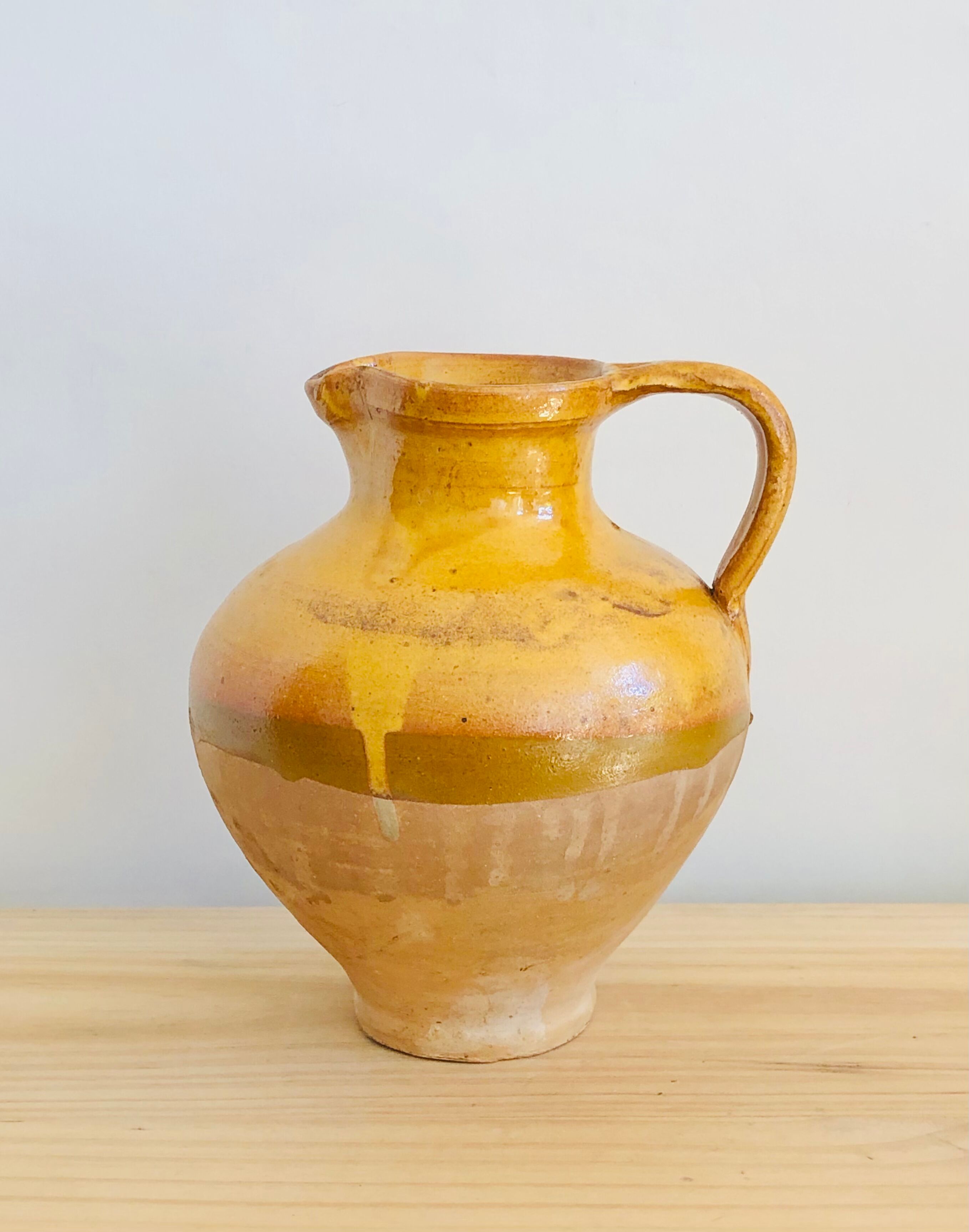 Vintage jug in glazed earth