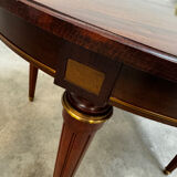 Extendable mahogany round table in Louis XVI style