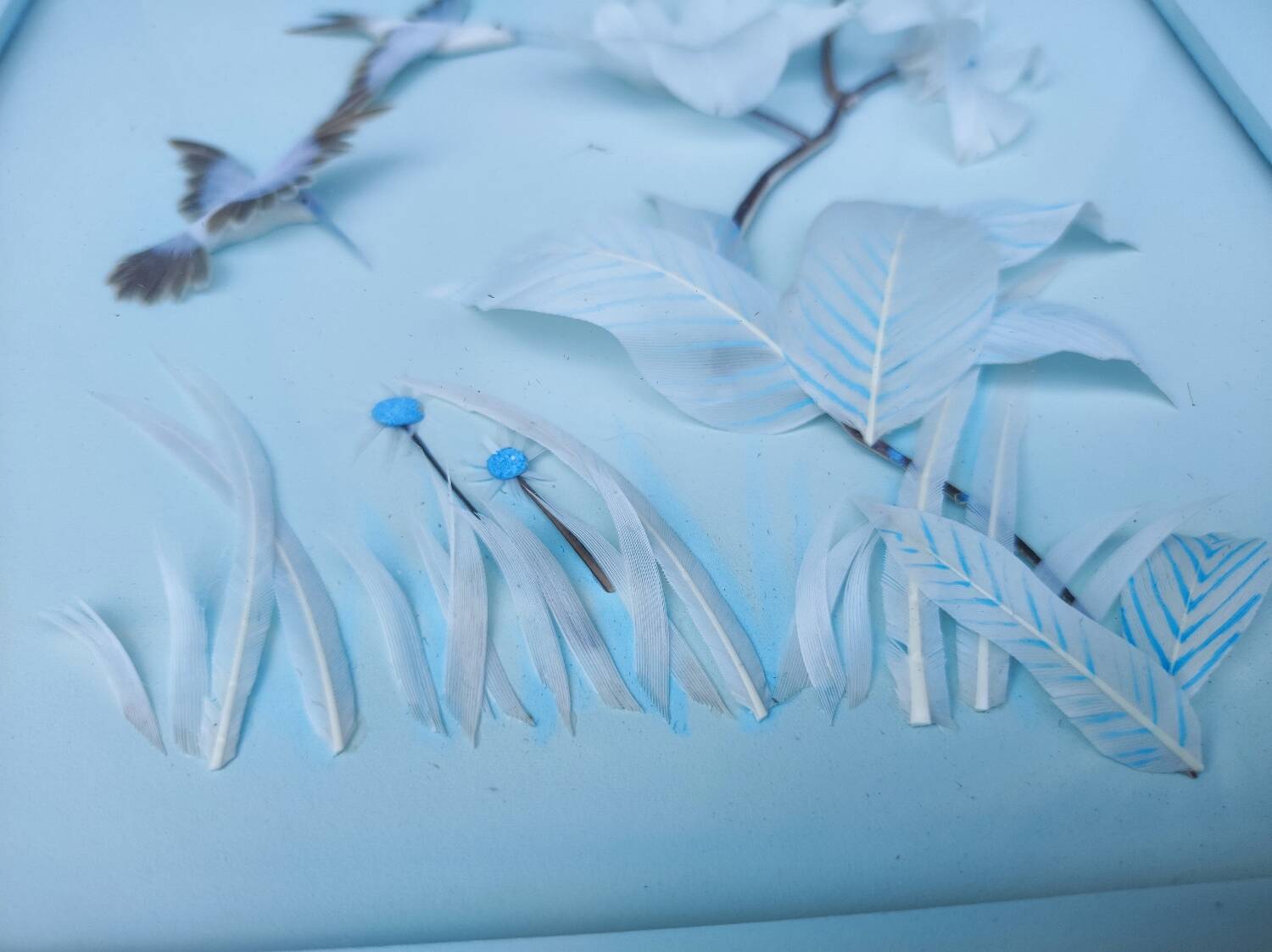 Two vintage paintings made with feathers, hummingbird motif