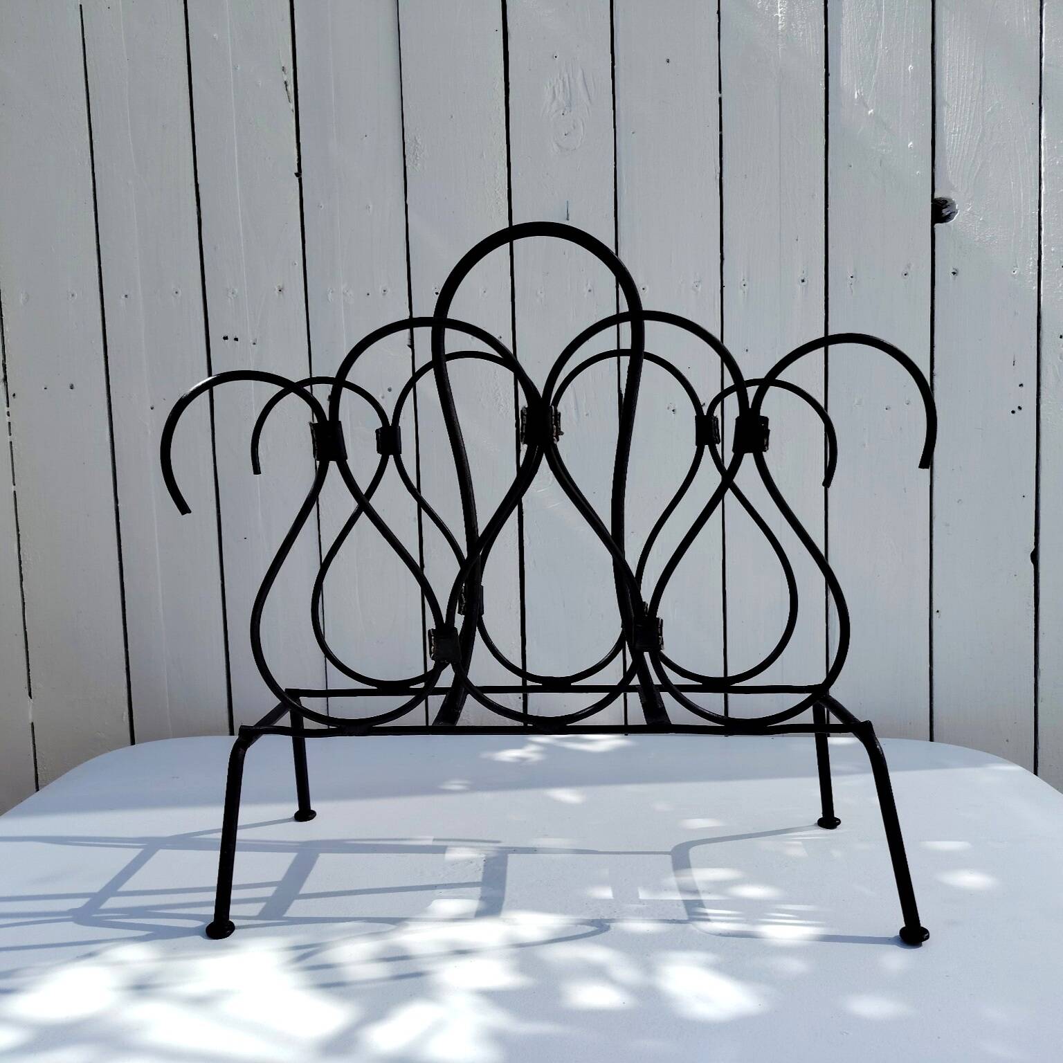 Metal and leather magazine rack, attributed to Jacques Adnet, vintage