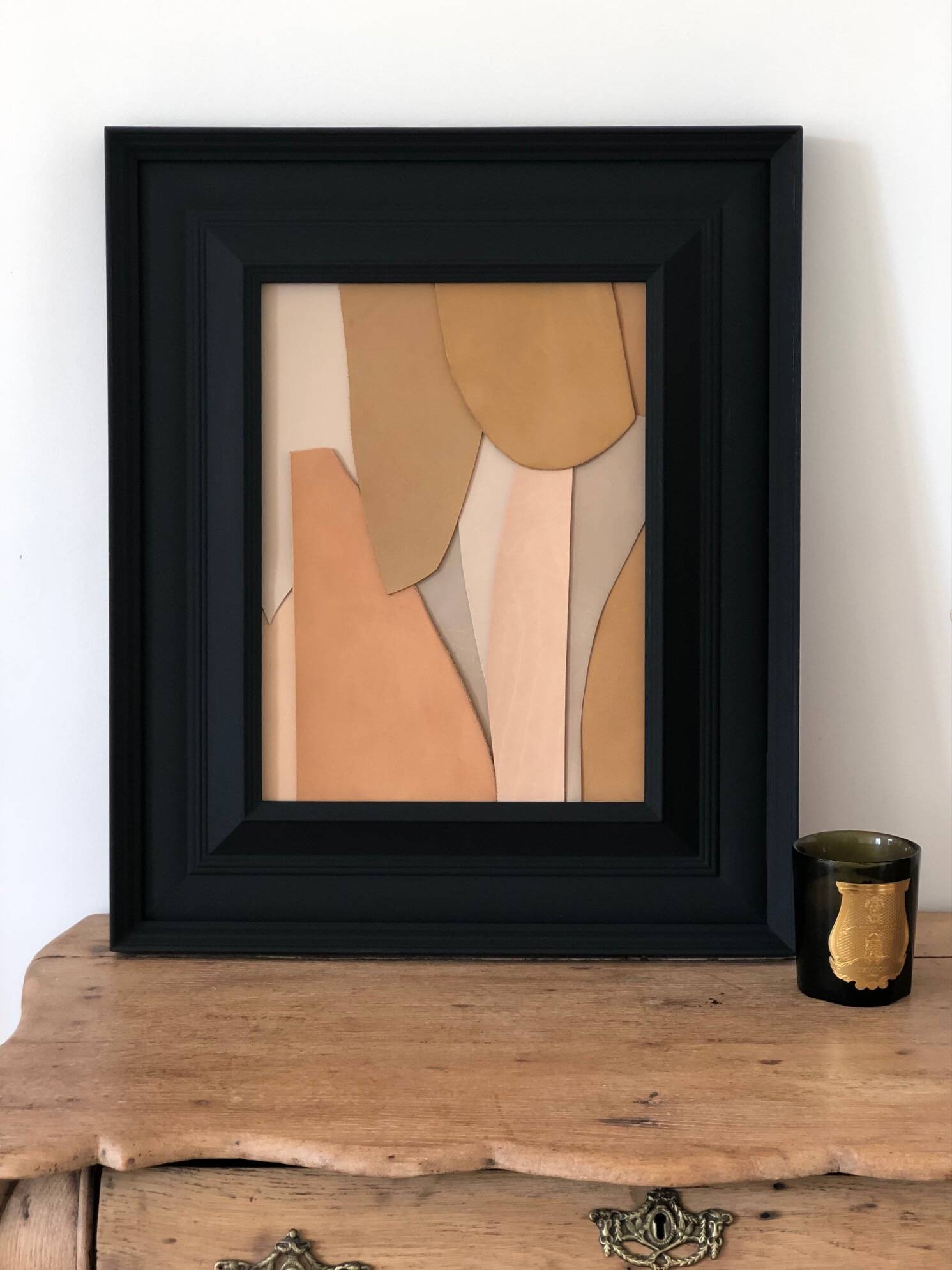 Leather table with a matte black wooden frame