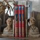 Book-clamps couple of realistic old men in plaster