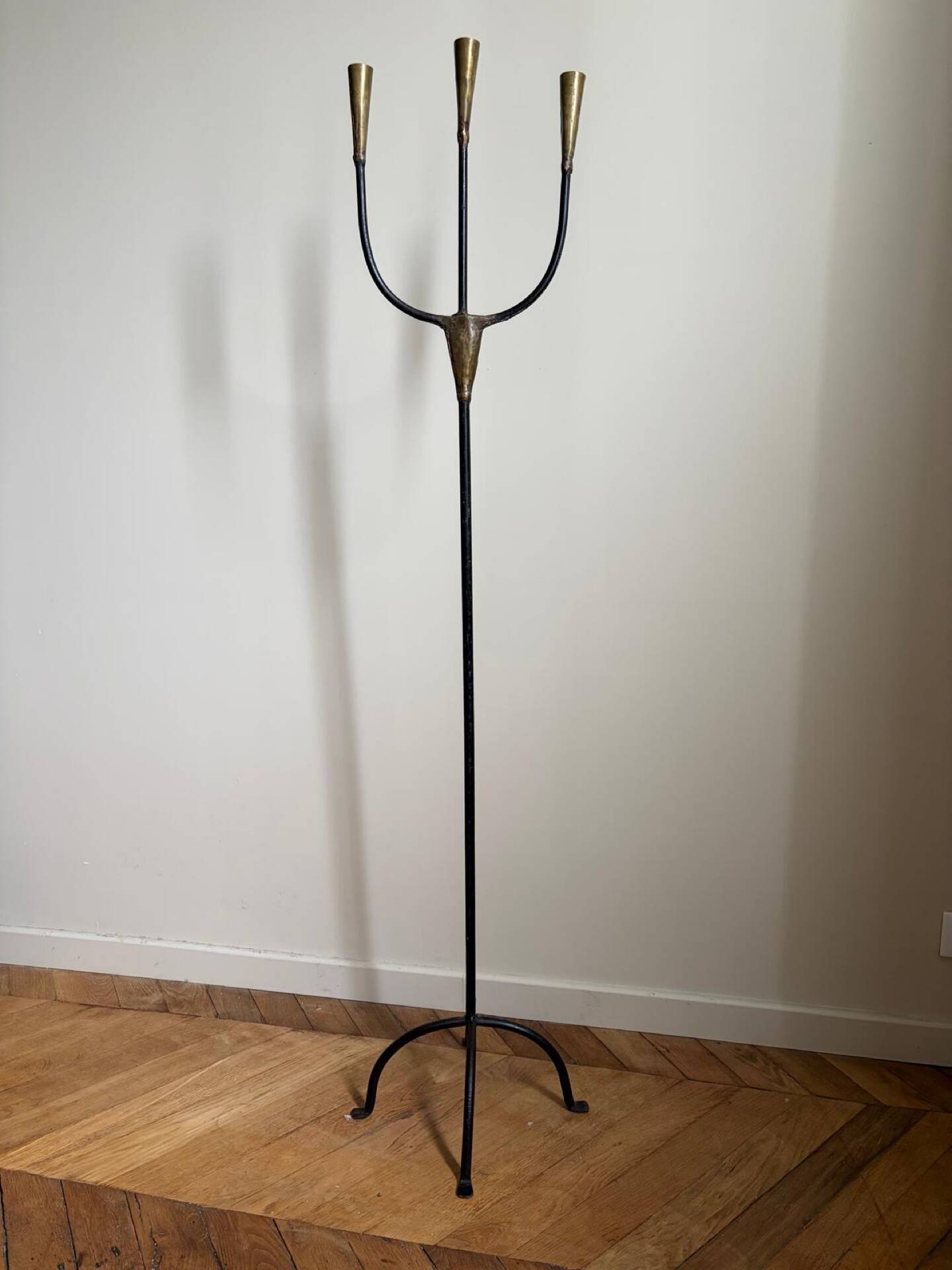 Candelabrum for the floor in wrought iron and brass.