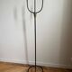 Candelabrum for the floor in wrought iron and brass.