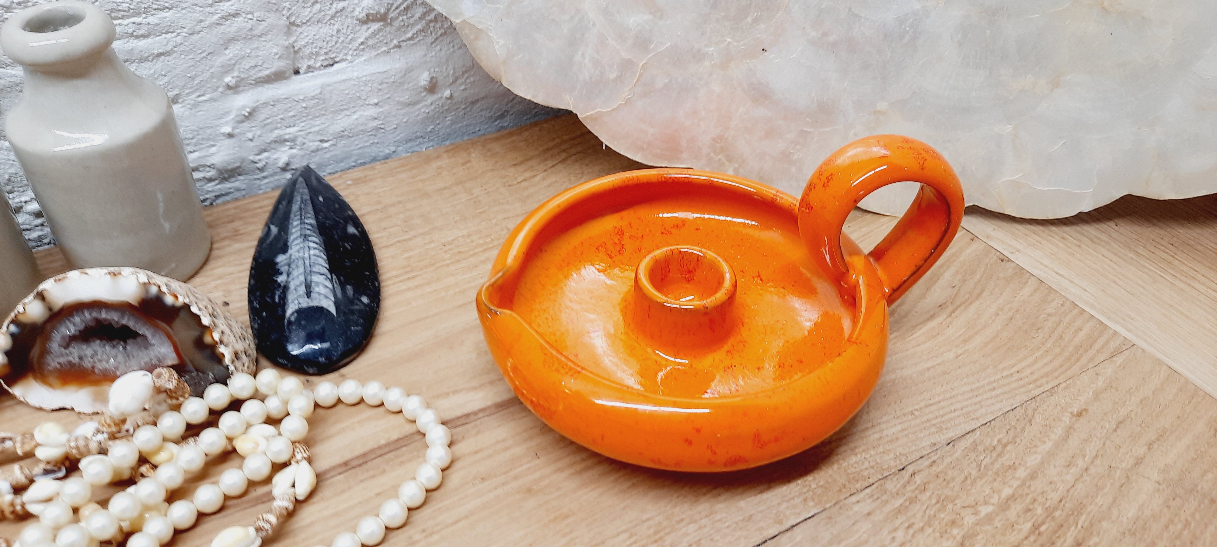 Orange cellar rat candle holder