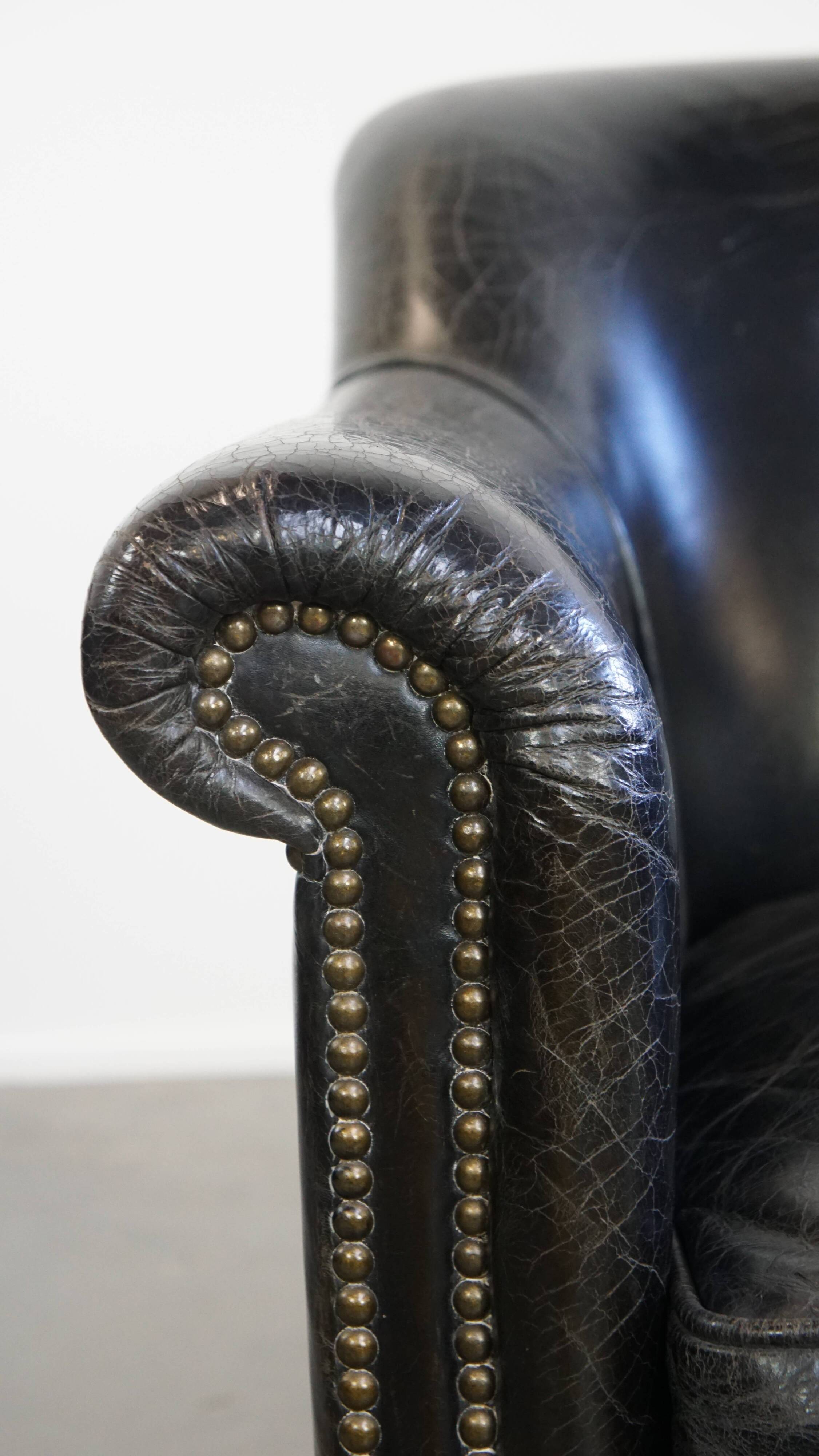 Black grained cowhide leather armchair