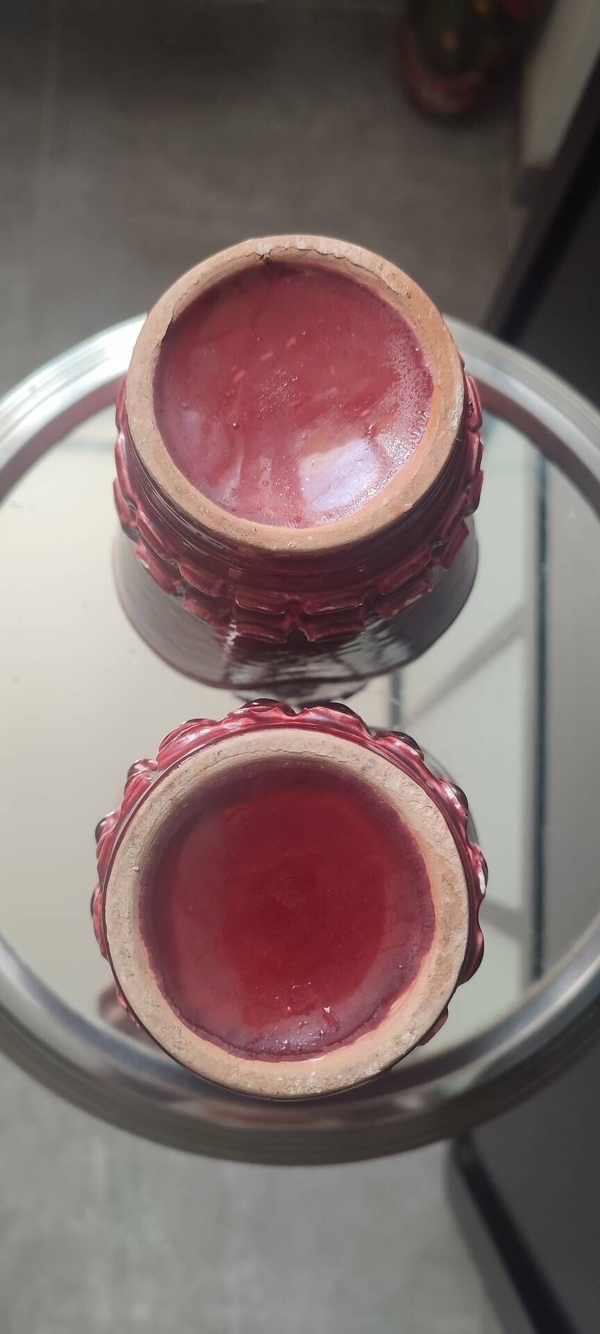 Pair of Art Deco asymmetrical red oxblood ceramic vases