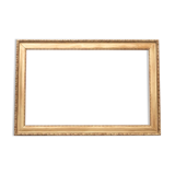 Horizontal mirror in a gold frame.