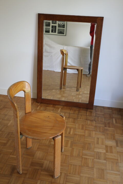 Beveled mirror grooved wood