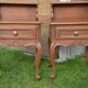 Two oak bedside tables.