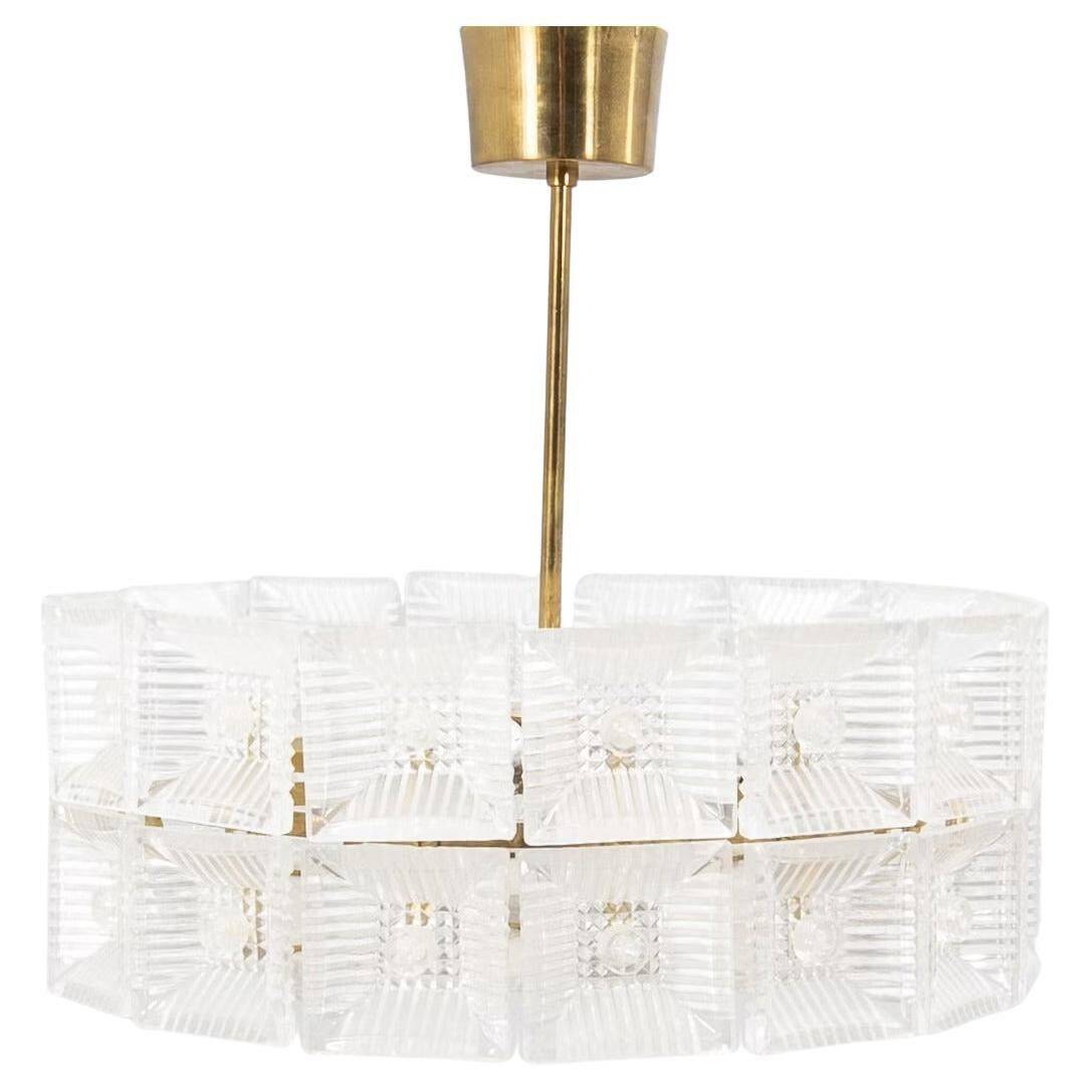 Suspended glass and brass lamp by Carl Fagerlund for Orrefors, Sweden, 1960.